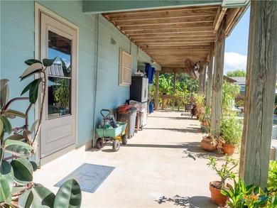 Welcome to this exceptional 2,488 sq ft two-story coastal home