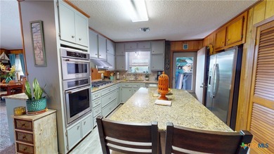 Welcome to this exceptional 2,488 sq ft two-story coastal home