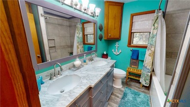 Welcome to this exceptional 2,488 sq ft two-story coastal home