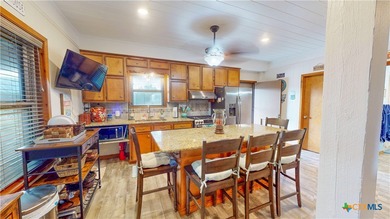 Welcome to this exceptional 2,488 sq ft two-story coastal home