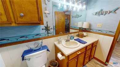 Welcome to this exceptional 2,488 sq ft two-story coastal home