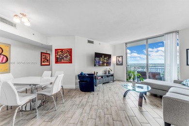 Located on a high floor of Metropolis II, Unit 908 offers a