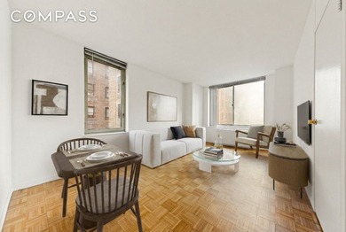 Residence 14B at the Cosmopolitan Condominium is a bright and - photo 1