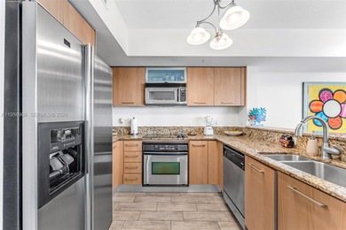 Located on a high floor of Metropolis II, Unit 908 offers a