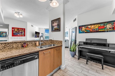Located on a high floor of Metropolis II, Unit 908 offers a
