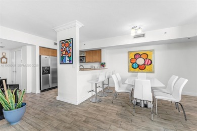 Located on a high floor of Metropolis II, Unit 908 offers a