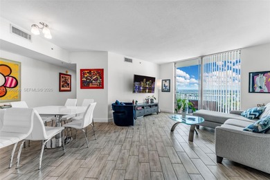 Located on a high floor of Metropolis II, Unit 908 offers a