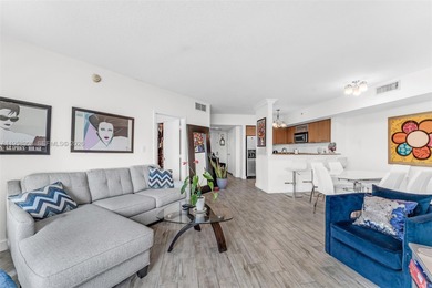 Located on a high floor of Metropolis II, Unit 908 offers a