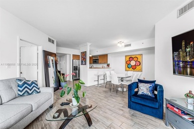 Located on a high floor of Metropolis II, Unit 908 offers a