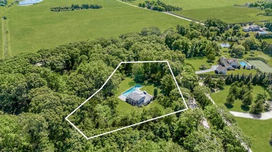 Secluded and serene on 1.1 lush acres in Water Mill, this - photo 1