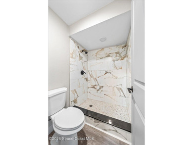 Welcome to a home where comfort meets style. This updated - photo 15