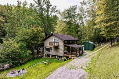 Tucked away in the mountains of West Virginia, this lovely - photo 3
