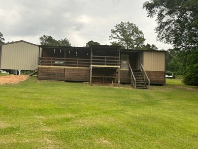 Nestled on approximately .54 acres along the water with a - photo 11