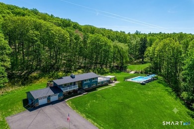 Set on over 20 breathtaking, wooded acres, this property offers - photo 1