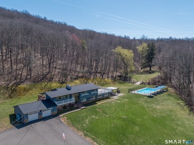Set on over 20 breathtaking, wooded acres, this property offers - photo 2