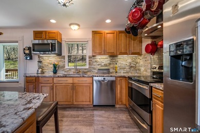 Set on over 20 breathtaking, wooded acres, this property offers - photo 8