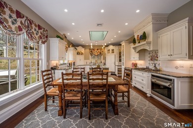 Set on 5.65 secluded acres in the heart of Madison, this - photo 8