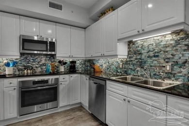 This 3br/3ba 1st floor condo has a second level view. It's - photo 11