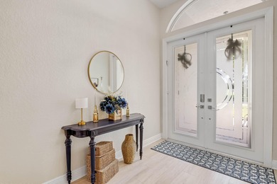 Nestled within a gated community, this spacious split-plan home