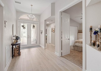 Nestled within a gated community, this spacious split-plan home