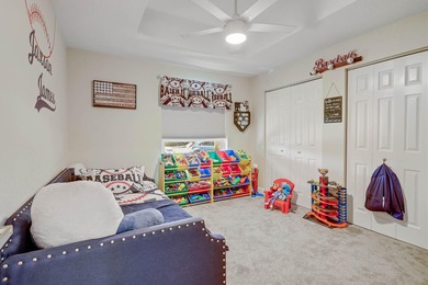 Nestled within a gated community, this spacious split-plan home