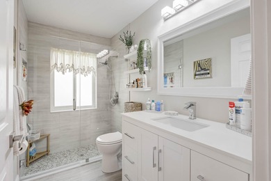 Nestled within a gated community, this spacious split-plan home