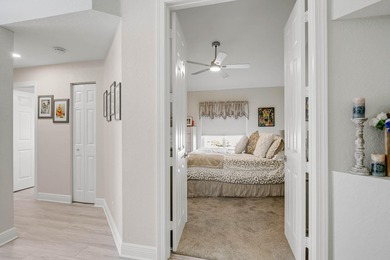 Nestled within a gated community, this spacious split-plan home