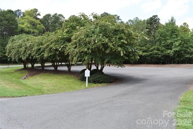 This Badin Lake area lot is located in the prestigious gated - photo 17
