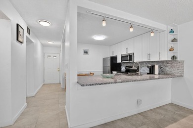 Fully updated 2/2 with 1-car garage! Features an open kitchen - photo 1