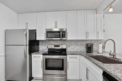Fully updated 2/2 with 1-car garage! Features an open kitchen - photo 7