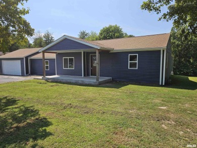 This stunning ranch-style home has been completely remodeled and