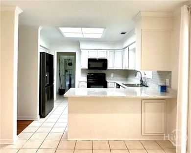 Experience the best of gated island living in this charming - photo 7