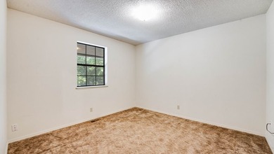 Come home to this charming house nestled in the woods on over an - photo 25