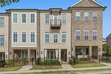 Elevated Living in Gated Waterside | Rare 3-Story Townhome with - photo 1