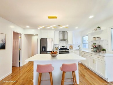 Beautifully renovated detached single-family home located in the - photo 3
