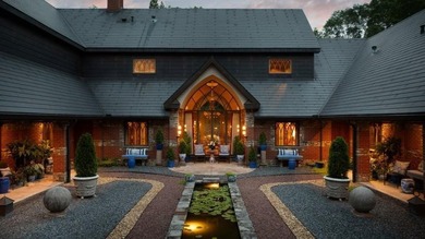 Nestled on approximately 8 private, gated acres, this - photo 1