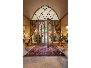 Nestled on approximately 8 private, gated acres, this - photo 9