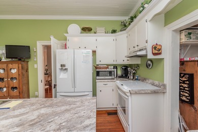 Nestled in the heart of downtown Aiken, this beautifully