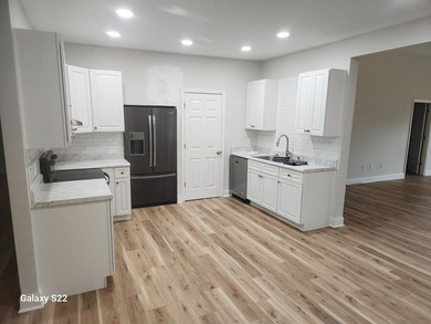 GREAT NEW PRICE ON THIS COMPLETELY RENOVATED LAKE HOUSE!! - photo 3