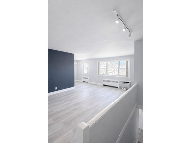 Welcome home to this sun-filled second-floor corner unit in a - photo 2