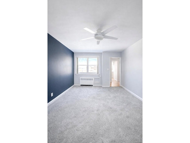Welcome home to this sun-filled second-floor corner unit in a - photo 4