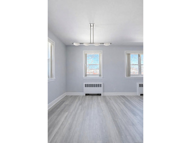 Welcome home to this sun-filled second-floor corner unit in a - photo 7