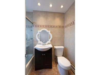 Welcome home to this sun-filled second-floor corner unit in a - photo 9