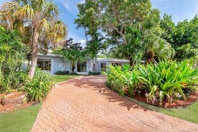 Remodeled 4-bedroom, 2-bath custom-built home featuring an open - photo 2