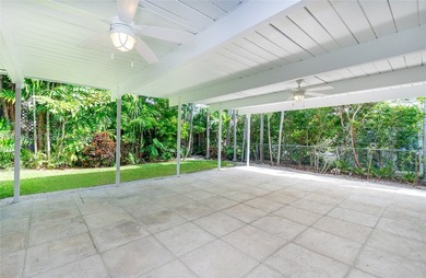 Remodeled 4-bedroom, 2-bath custom-built home featuring an open - photo 3