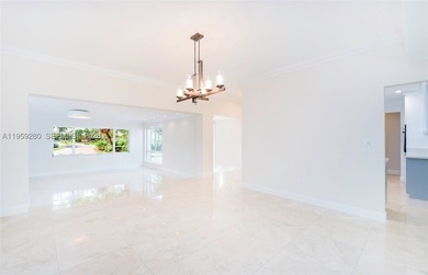 Remodeled 4-bedroom, 2-bath custom-built home featuring an open - photo 9