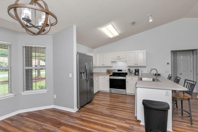 This charming brick home delivers a warm, functional layout - photo 12