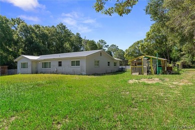 Nestled on approximately 1.6 acres in Homosassa, this charming - photo 27