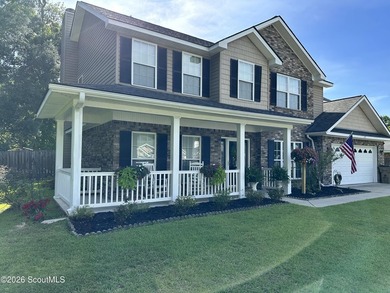 Welcome to this beautifully maintained 5-bedroom, 3-bath brick - photo 2