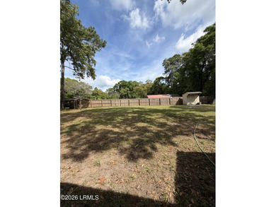Charming 3-bedroom, 1.5-bath brick home situated on nearly half - photo 12